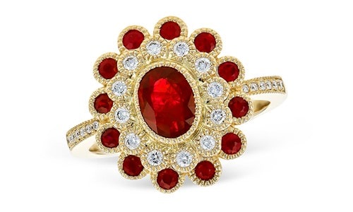 Fashion ring with a ruby center stone surrounded by a unique ruby and diamond halo. Design by Allison-Kaufman