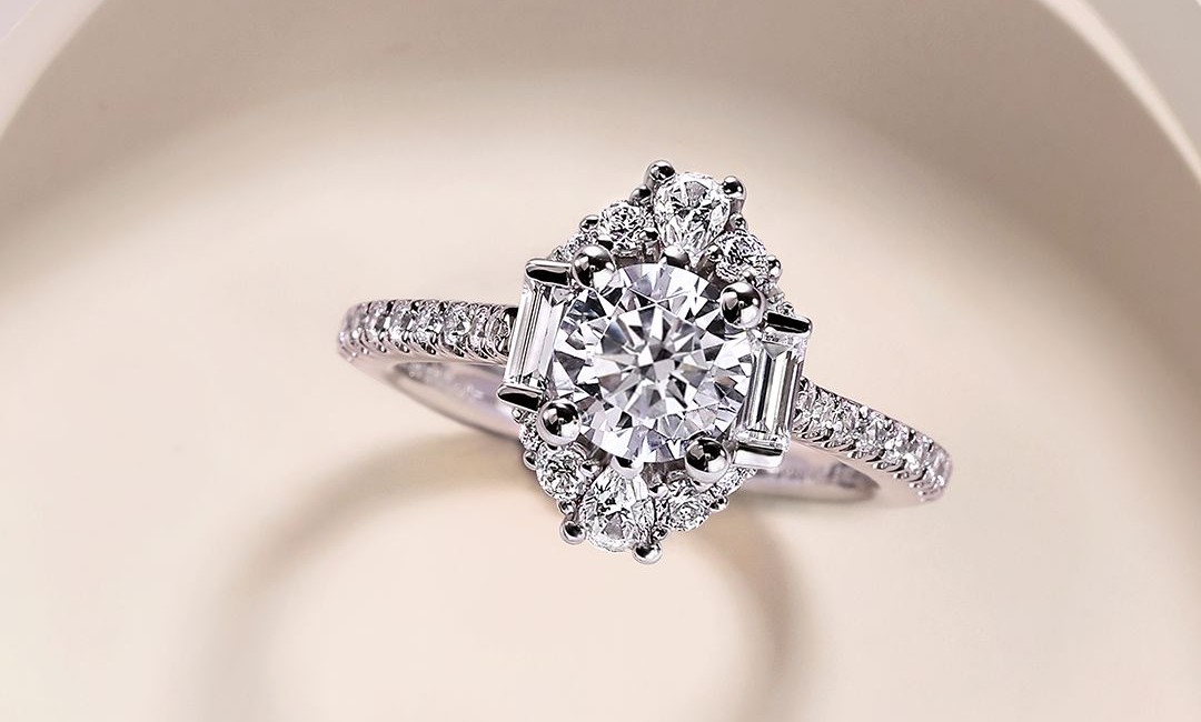 Gabriel & Co. engagement ring with baguette and round diamond halo