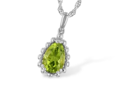 A solitaire peridot necklace features a pear-shaped gemstone