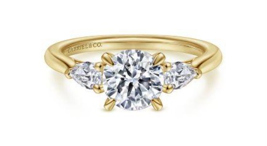A yellow gold three stone engagement ring by Gabriel & Co.