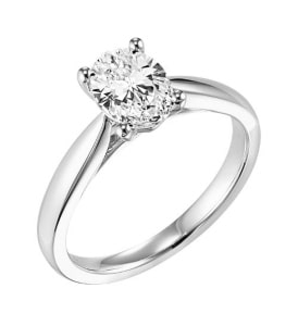 A 14k white gold solitaire engagement ring with an oval-cut diamond from Goldman