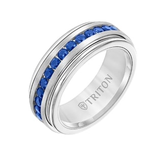 A platinum men’s wedding band with sapphire accents.