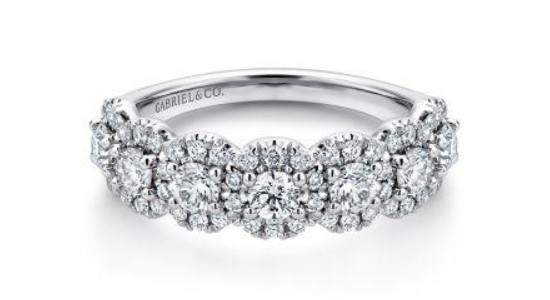 a white gold fashion ring by Gabriel & Co. set with diamond halos