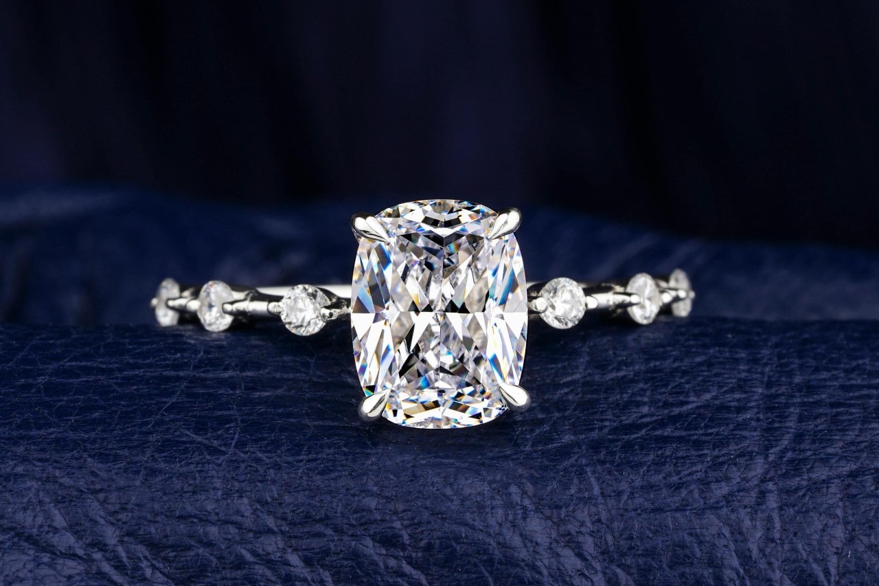 close up image of an engagement ring with a large center stone and side stones