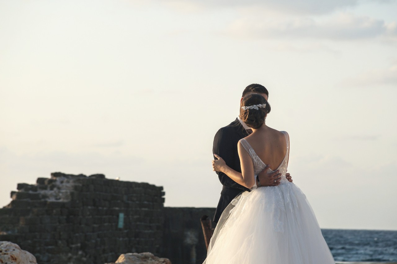 couple embracing by the ocean